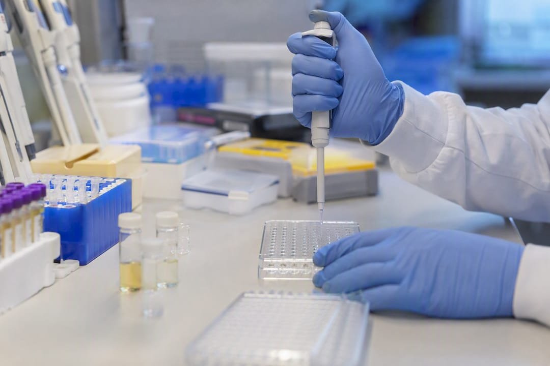 Hands preparing peptide reagent for validation